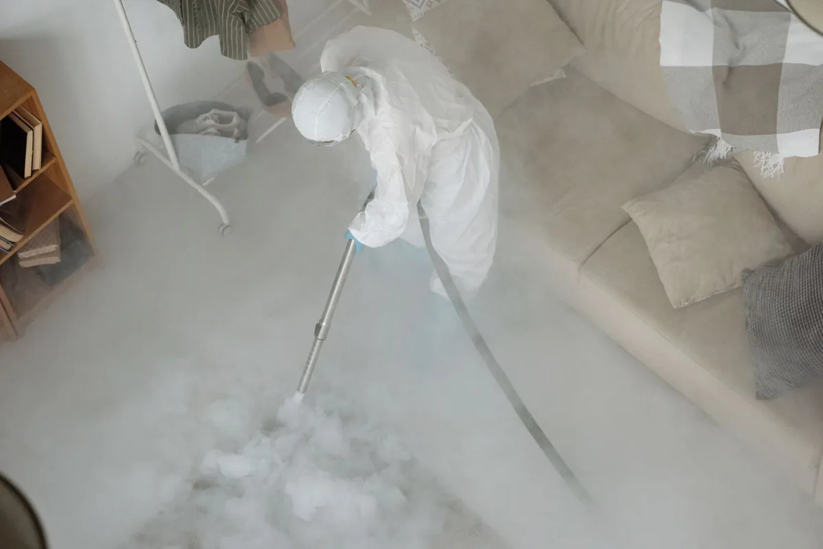Biohazard cleanup technician in protective equipment, Dayton, VA